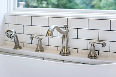 Delta Cassidy tub faucet shown in a remodeled bathroom