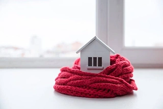 House with scarf for how to get your home ready for winter